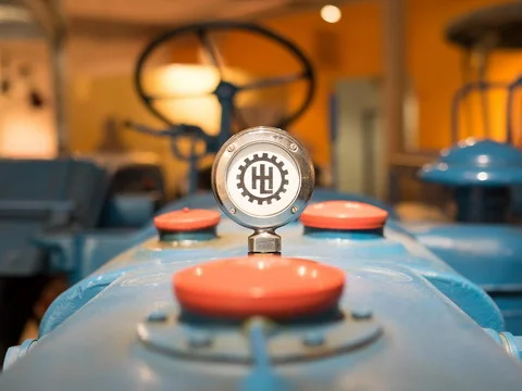 Close-up of a classic tractor engine hood badge
