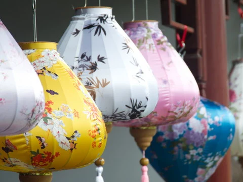 Close-up of a traditional floral and bird pattern painted lantern